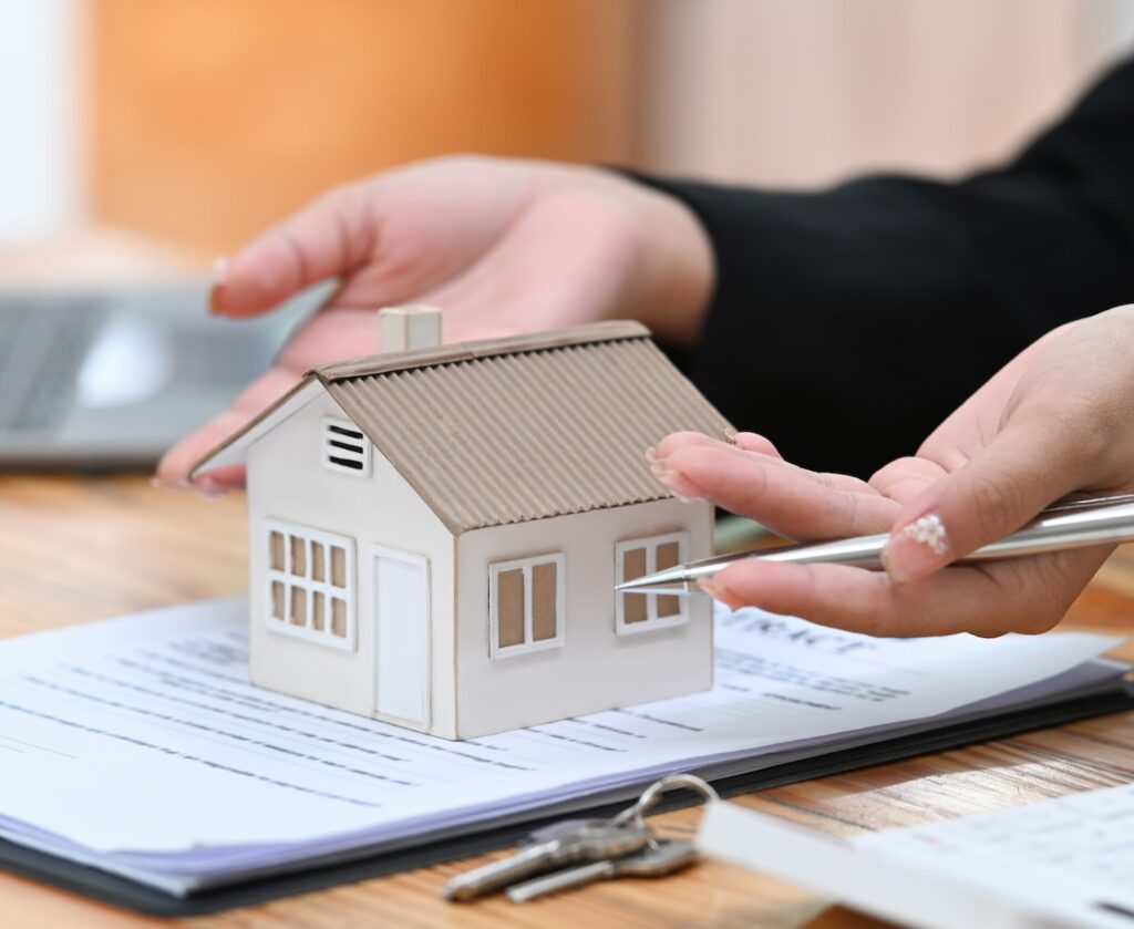 Cropped image of real estate agent offering future property purchase contract terms.